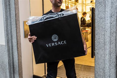 did michael kors buy versace|which brands do versace own.